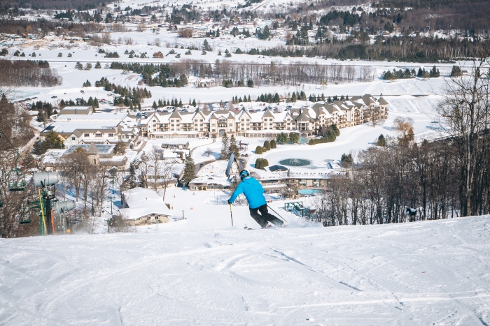 Man skiing down hill at Boyne Mountain Resort