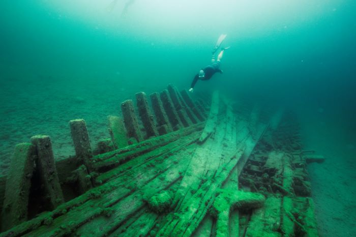 Man snorkeling over shipwreck in Lake Huron