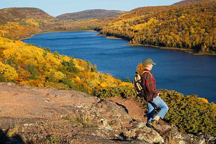 Hiker at Lake of the Clouds during Fall