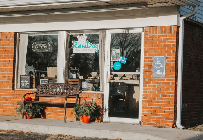The Raw Dog Rescue Boutique storefront decorated for Christmas.