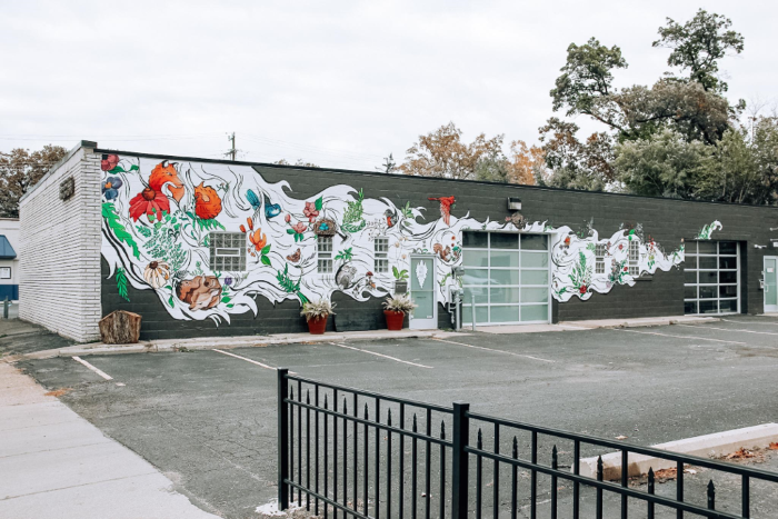 Floral mural on exterior wall of Long White Beard Furniture.